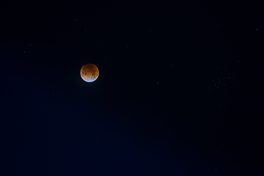 A partially eclipsed moon in a dark sky