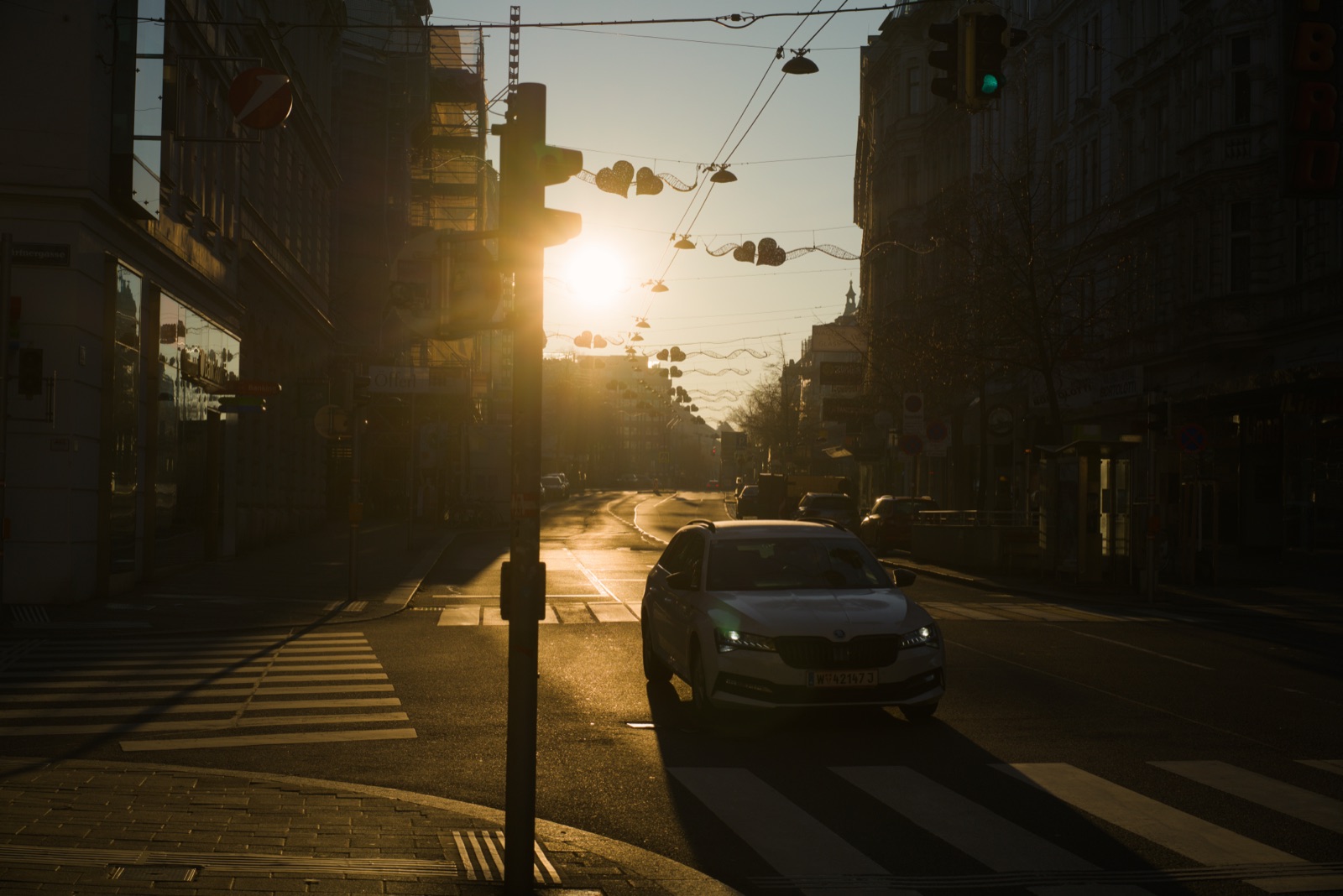 Low winter sun flaring down a Vienna street