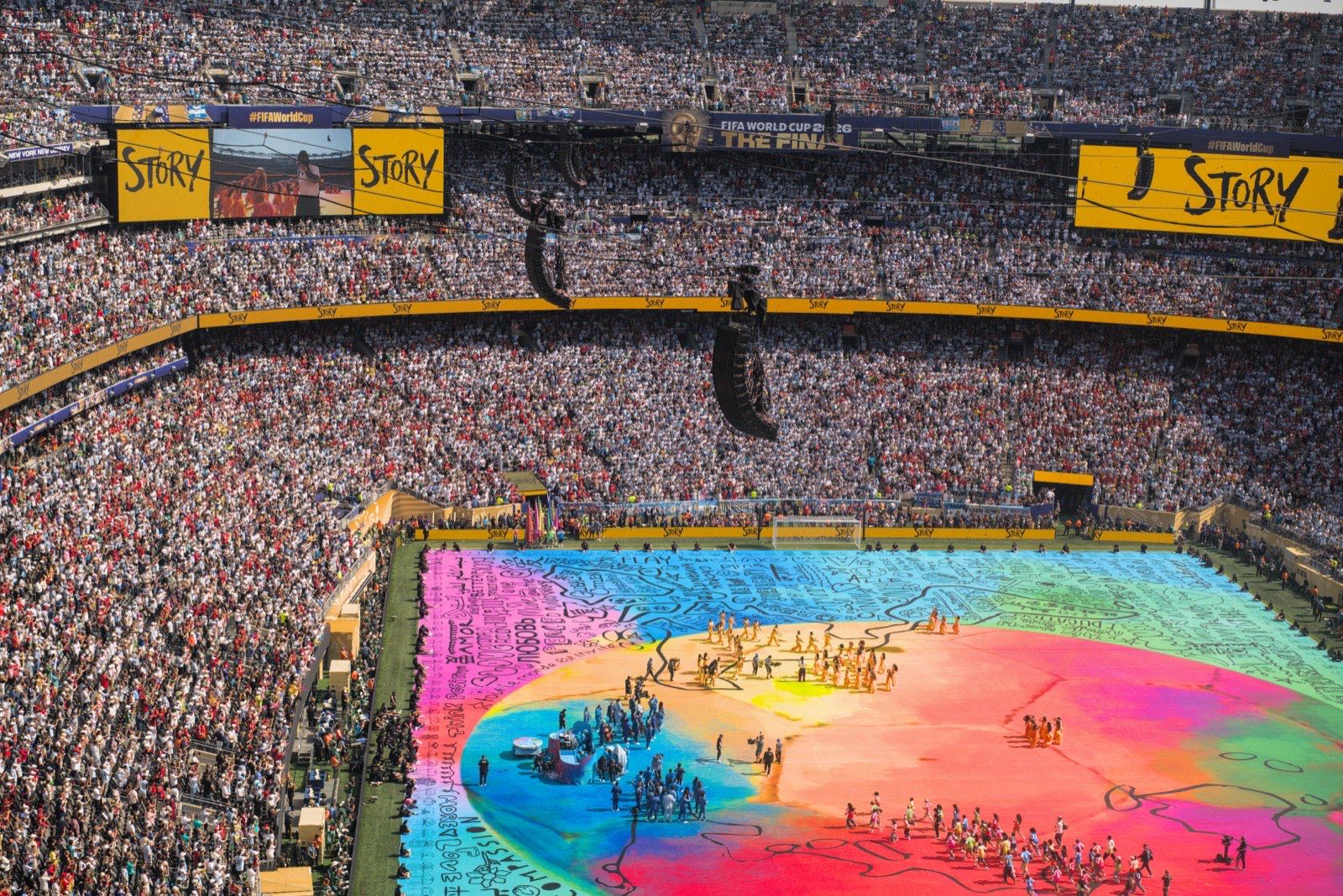 A rainbow-colored stage covering the pitch during the halftime show